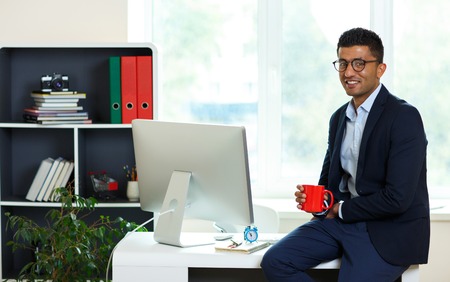 Handsome young man working from home office - modern business conceptの写真素材