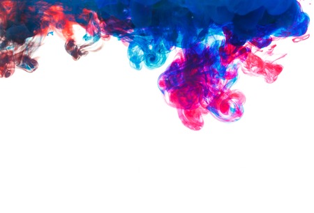 Color drop underwater creating a silk drapery. Ink swirling underwater. Cloud of colorful inkの写真素材