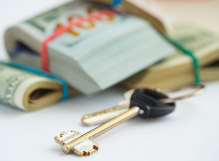 Success and got profit from business with pile of American dollars with keys - concept of buying new...