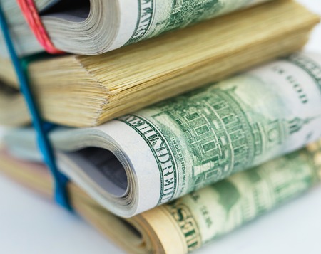 Success and got profit from business with pile of American dollarsの写真素材