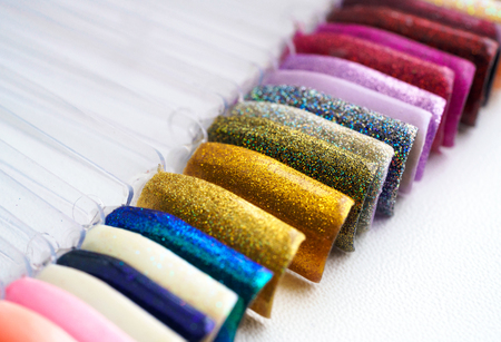Background from different colorful nails polish palette for a manicureの写真素材