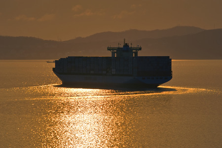 Large container ship coming over the sea at sunset. Nakhodka Bay. East (Japan) Sea. 19.04.2014のeditorial素材