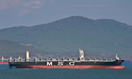 Container ship MSC Amalfi standing on the roads at anchor. Nakhodka Bay. East (Japan) Sea. 13.05.2014のeditorial素材