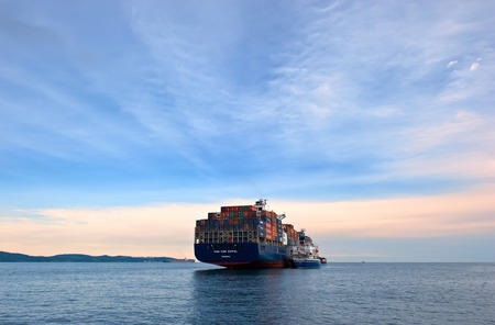 Nakhodka. Russia - June 30, 2015: Bunkering tanker Russian Island container ship CMA CGM Eiffel.のeditorial素材