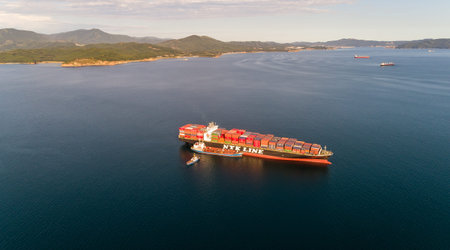 Nakhodka. Russia - September 02, 2017: Bunkering tanker Ostrov Russkiy a large container ship NYK...
