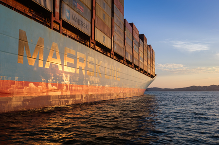 Nakhodka. Russia - August 22, 2017: Container ship Gerner Maersk at anchor in the roads on the sanset.のeditorial素材
