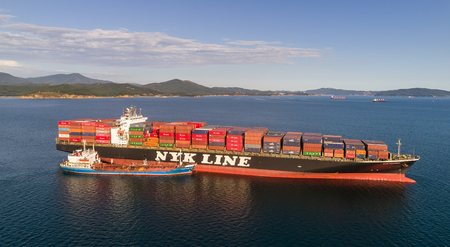 Nakhodka. Russia - September 02, 2017: Bunkering tanker Ostrov Russkiy a large container ship NYK Aquarius.のeditorial素材