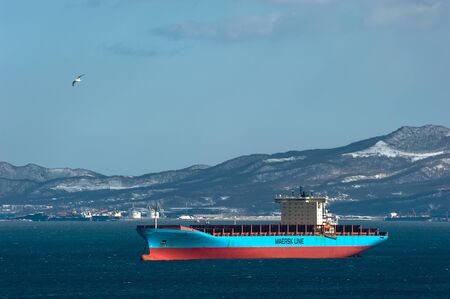 Nakhodka. Russia - March 22, 2019: Container ship Adrian Maersk at anchor in the roads.のeditorial素材