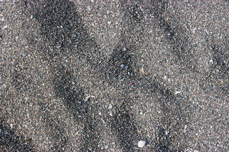 Black volcanic sand from the island of Santorini in Greece. Excellent texture for the background, similar to iron filings.の写真素材