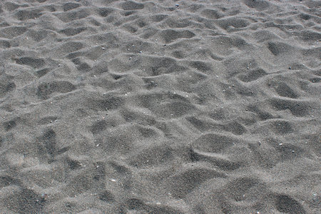 Black volcanic sand. Excellent texture for the background, similar to iron filings.の写真素材