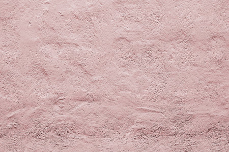 Wall plaster painted in pink color texturedの写真素材