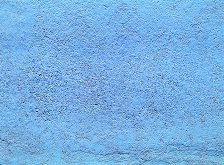 The wall plaster painted blue color texturedの写真素材