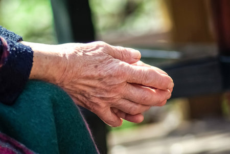 Wrinkled old woman hands close upの写真素材