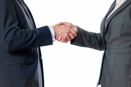 Close-up of businessman and businesswoman shaking hands isolated on white backgroundの写真素材