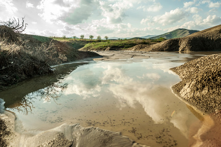 Small lake near muddy volcanoesの写真素材