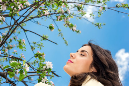 Beautiful young woman portrait and amazing blue sky on background