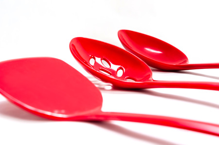 Plastic kitchen utensils on isolated on whiteの写真素材