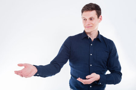 Young professional showing with handsの写真素材