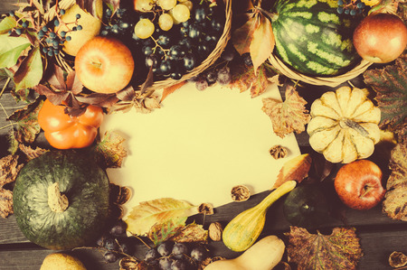 Autumn nature concept. Fall fruit and vegetables on wood. Thanksgivingの写真素材