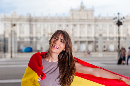 Young woman in front of Palacio de Orienteの写真素材
