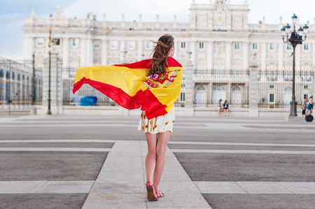 Young woman in front of Palacio de Oriente の写真素材