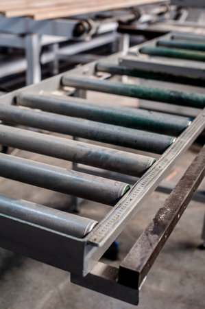 Close-up of furniture manufacture production machine components.