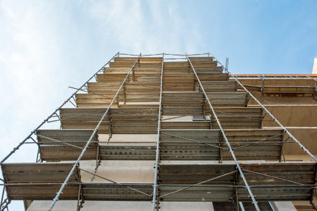 Building block of flats under construction with scaffolding.