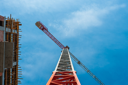 Building block of flats under construction , with crane.の写真素材