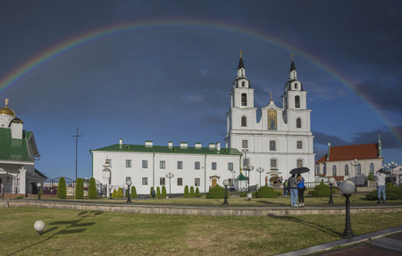 Belarus, Minsk: Svyatodukhov a cathedral and a rainbow after summer heavy rain.の写真素材