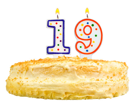 birthday cake with candles number nineteen isolated on white backgroundの写真素材