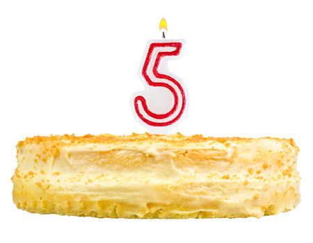 birthday cake with candles number five isolated on white backgroundの写真素材