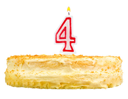 birthday cake with candles number four isolated on white backgroundの写真素材