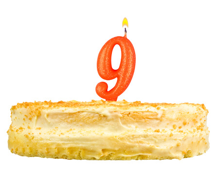 birthday cake with candles number nine isolated on white backgroundの写真素材