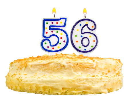 birthday cake with candles number fifty six isolated on white backgroundの写真素材