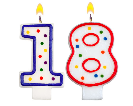 Birthday candles number eighteen isolated on white backgroundの写真素材