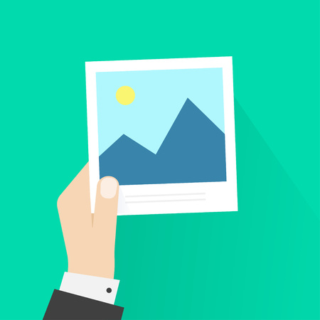 Hand holding photo frame vector illustration, photo card in photographer man hand, cartoon flat style with shadow, postcard, modern design isolated on green backgroundのイラスト素材