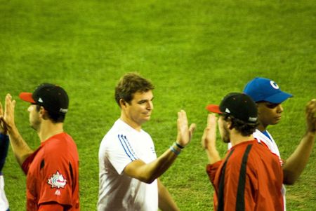 Cuba-Canada semifinal game .5/september/2009.After the game the two teams shake hands.In the midle of the picture the doctor Antoino Castro,soon of the historical leader Fidel Castro and member of the cuban delegation.のeditorial素材