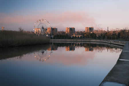Extreme park near the river in autumn time evening, red sky beautiful sunset with red cloudの写真素材