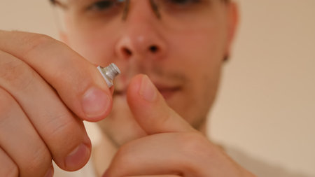 Man with herpes on lips against light grey background. Cold sore on a man lips. Sore virus concept....
