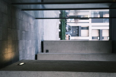 Long tunnel with columns and mirrors in modern city architecture with low lights and grey colors with tile on the frloorの写真素材