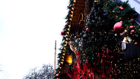 beautifully decorated entrance to home for Christmas holidays featuring reindeer figurine, red...