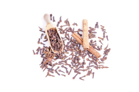 Cloves, anis and cinnamon sticks on isolated background