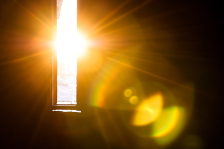 Rays of sun through the small window in the castle