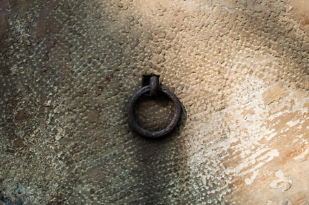Metal handle on the door of the ancient entombementの写真素材