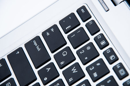Part of laptop keyboard on a white background