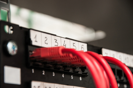 Communication panel in a rack with 5 cables