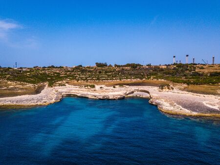 Beautiful blue water and white rocks on the sea coastの写真素材