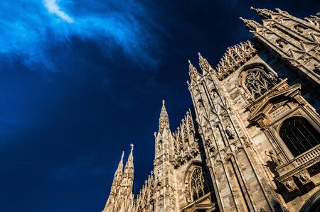 Duomo cathedral in Milan with spectacular sky on the backgroundの写真素材