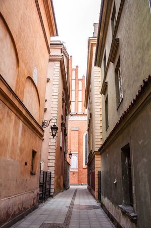 Narrow street between two old cathedral in the ancient cityの写真素材