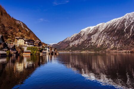 Hallstatt view from the lake with snow covered mountains on the backgroundの写真素材